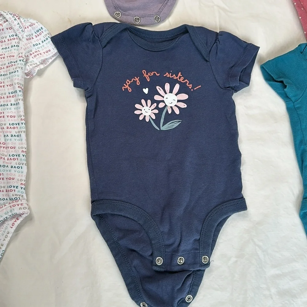 Carter’s bundle of 6 short sleeve baby girl onesies. They all have cute sayings.